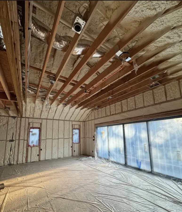 Interior walls and ceiling insulated with spray foam during new construction in Greenwood